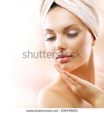 Spa Woman. Beautiful Girl After Bath Touching Her Face. Perfect Skin. Skincare. Young Skin