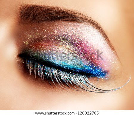 Eye Makeup. Beautiful Eyes Glitter Make-up. Holiday Makeup detail. False Lashes