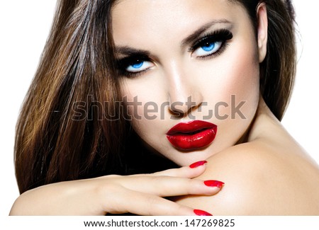 Sexy Beauty Girl with Red Lips and Nails. Provocative Make up. Luxury Woman with Blue Eyes. Fashion Brunette Portrait isolated on a white background. Gorgeous Woman Face. Long Hair