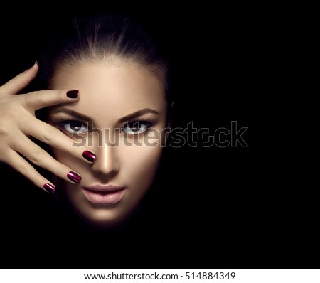 Perfect woman face portrait lips with fashion natural beige matte lipstick makeup. Beauty brunette sexy model girl with beautiful skin close up. Manicure, beautiful nails