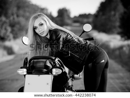 Beautiful woman on the motorcycle black and white Beautiful woman on the motorcycle black and white