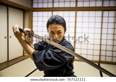 stock-photo-samurai-training-in-a-tradit