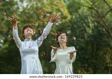 HANOI, VIETNAM, MAY 26: Unidentified Vietnamese girl wear Ao dai n May 26, 2011 in Hanoi, Vietnam. Ao dai is famous traditional custume for woman in VIetnam.