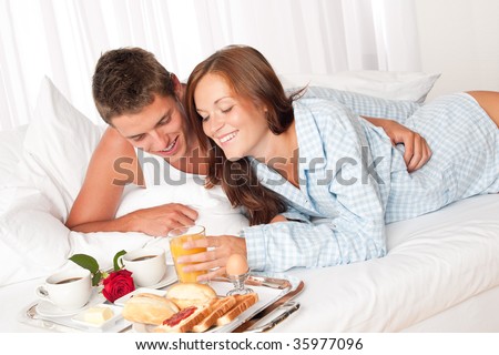 https://thumb7.shutterstock.com/display_pic_with_logo/206023/206023,1251355714,1/stock-photo-happy-man-and-woman-having-luxury-hotel-breakfast-in-bed-together-35977096.jpg