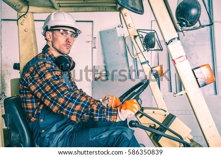 caucasian forklift operator inside the forklift heavy duty workplace equipment - Duties Of A Forklift Operator caucasian forklift operator inside the forklift heavy duty workplace equipment - Duties Of A Forklift Operator