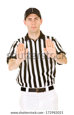 Referee: Male Ref Gives Signal For Pass Interference - stock photo