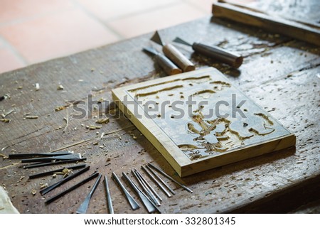 Bac Ninh, Vietnam - Sep 9, 2015: Wooden painting is being made in workshop by craftsman in Dong Ho folk painting village