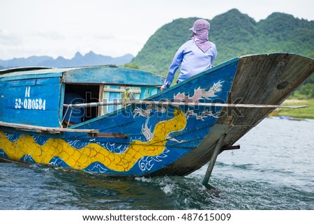 Quang Binh, Vietnam - June 16, 2016: Closeup Semi power/rowing tourism boat on river to Phong Nha cave, Phong Nha - Ke Bang national park, Quang Binh, Vietnam
