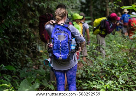 Quang Binh, Vietnam - June 17, 2016: Group of hikers walking on forest heading to Son Doong cave - the largest known cave passage in the world by volume in Quang Binh province, Vietnam