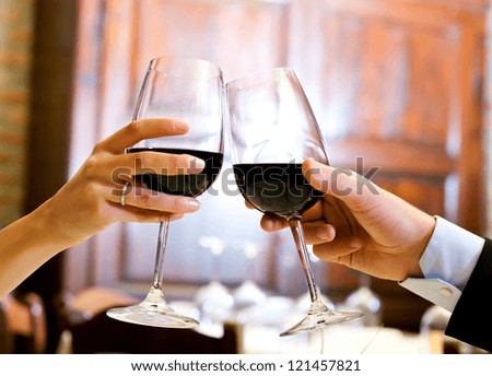 Couple toasting wine glasses