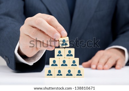 Human resources and corporate hierarchy concept - recruiter complete team by one leader person (successor, CEO) represented by icon.