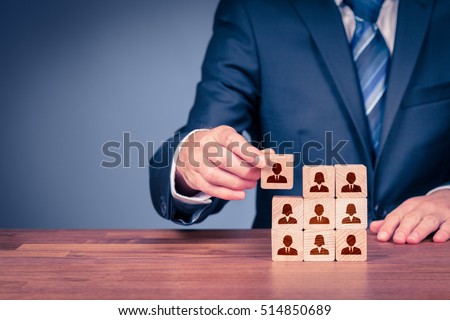 Human resources, social networking, assessment center concept, personal audit or CRM concept - recruiter complete team by one person. Employees are represented by wooden cubes with icons.