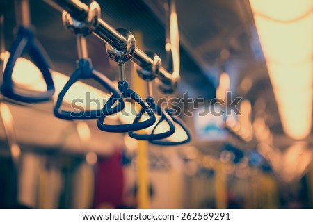 Metropolis. Handrails in a subway car in the photo instagram style.