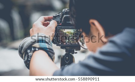 The photographer to pay close attention to take a photo. (vintage style)