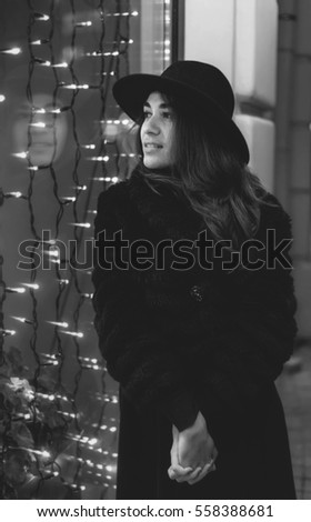 Outdoor fashion portrait of stylish young woman urban city street style black and white Outdoor fashion portrait of stylish young woman urban city street style black and white