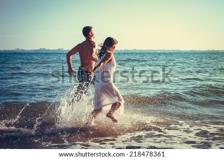 https://thumb7.shutterstock.com/display_pic_with_logo/220678/218478361/stock-photo-romantic-couple-having-fun-on-the-beach-218478361.jpg