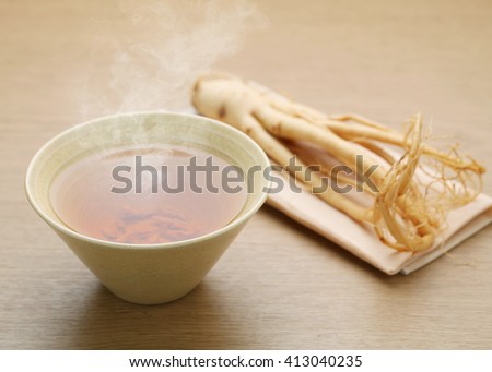 Ginseng tea on wood background, The concept of healthy drink.