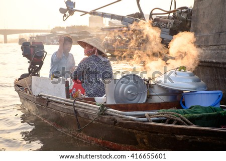 Can Tho, Vietnam - April 2, 2016: Boat cafe on Cai Rang floating market in the Mekong Delta river at sunset time