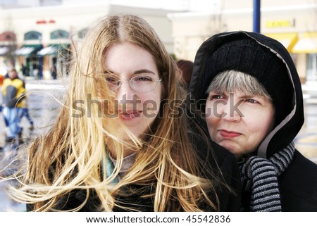 stock-photo-mother-and-daughter-huddled-together-in-the-cold-45542836.jpg