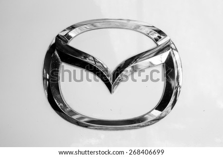 BANGKOK,THAILAND - April 11,2015 : Logo of the brand "Mazda" on white car