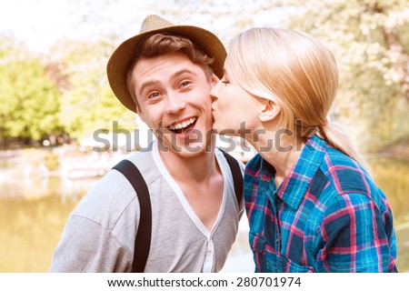 https://thumb7.shutterstock.com/display_pic_with_logo/2270597/280701974/stock-photo-so-happy-beautiful-young-lady-giving-kiss-to-cheek-to-his-boyfriend-in-park-on-background-of-lake-280701974.jpg