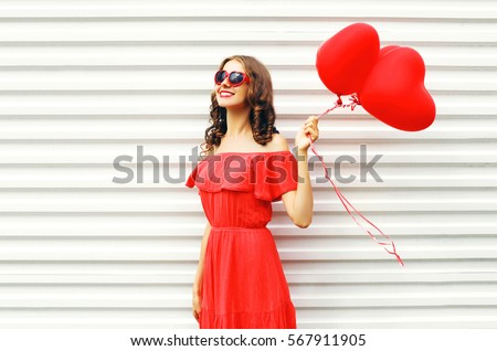 http://thumb7.shutterstock.com/display_pic_with_logo/2273876/567911905/stock-photo-fashion-pretty-happy-smiling-woman-in-red-dress-and-sunglasses-with-air-balloons-heart-shape-567911905.jpg