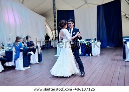 https://thumb7.shutterstock.com/display_pic_with_logo/2302709/486137125/stock-photo-wedding-couple-in-the-restaurant-is-dancing-beautiful-model-girl-in-white-dress-handsome-man-in-486137125.jpg
