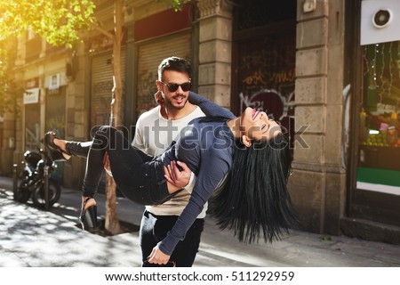https://thumb7.shutterstock.com/display_pic_with_logo/2324765/511292959/stock-photo-newlyweds-spend-their-honeymoon-and-have-fun-on-the-streets-of-a-spanish-town-handsome-young-511292959.jpg