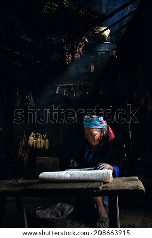Dien Bien Phu, Dien Bien, Vietnam August 1, 2014: The H'mong ethnic women in the high mountains of decorative painting on canvas, this is one of their traditional occupation.