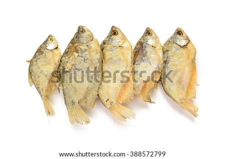 dried fish fillets skewers on a white background