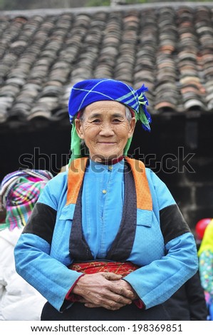HA GIANG, VIETNAM - FEBRUARY 19: Unidentified women of the Flower H'mong ethnic minority People at market on February 19, 2012 in Hagiang, Vietnam. There are about 800,000 thousand H'mongs in Vietnam.