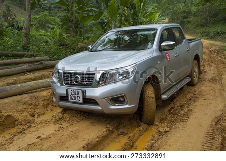 Tuyen Quang, Viet Nam - April 23, 2015: Nissan NP300 Navara running on the mud road in Vietnam