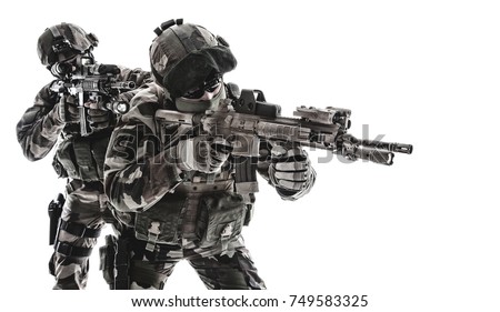Paratroopers of french 1st Marine Infantry Parachute Regiment RPIMA studio shot firing pointing weapons