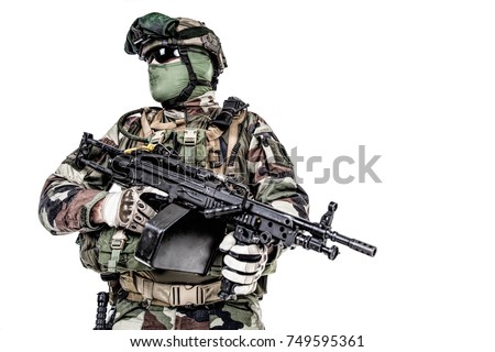 Paratrooper of french 1st Marine Infantry Parachute Regiment RPIMA studio shot firing pointing weapons