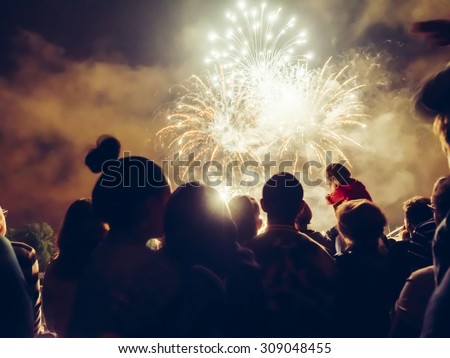 Crowd watching fireworks and celebrating