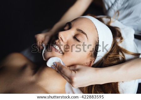 Masseur giving treatment to beautiful brunette