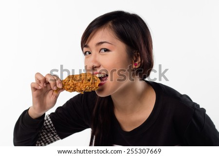 stock-photo-young-girl-holding-eating-fried-chicken-255307669.jpg