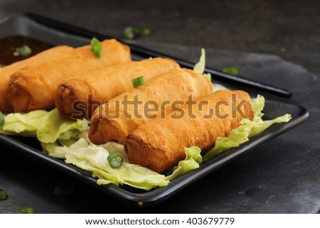 Spring Rolls on traditional Chinese serving dish, selective focus