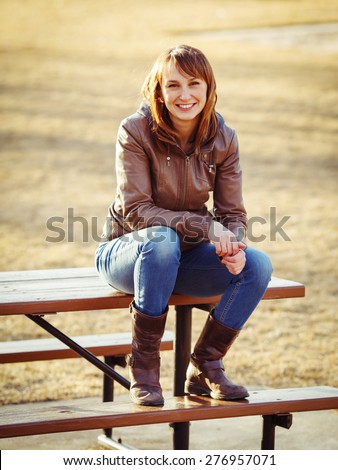 https://thumb7.shutterstock.com/display_pic_with_logo/2436572/276957071/stock-photo-portrait-of-a-young-sexy-white-caucasian-girl-woman-in-jacket-jeans-boots-sitting-on-the-wooden-276957071.jpg