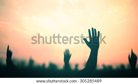 Human raised hands. Mercy Right Trust God Power Amnesty Black Liberty Islam Person Religion Pray Glorify Alone Adore Easter Cross Death Disciples Abstract Blur Helping Light Victim Someone concept.