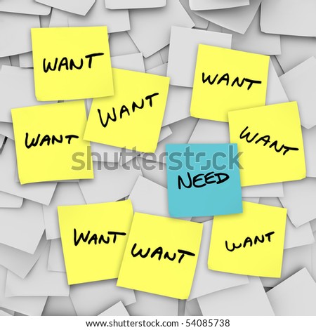 Many sticky notes with the word Want on them and one with the word Need