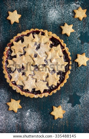 tart with berry jam and cookies, top view