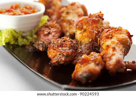 Hot Meat Dishes - Fried Chicken Wings with Curry Sauce - stock photo