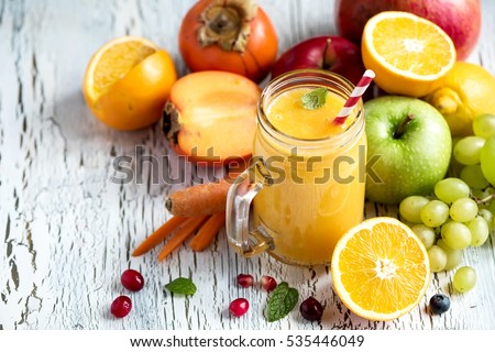 Yellow smoothie, healthy juicy vitamin drink diet or vegan food concept, fresh vitamins, homemade refreshing fruit beverage