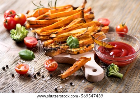 Healthy homemade sweet potato fries, vegan vegetarian snack with ketchup