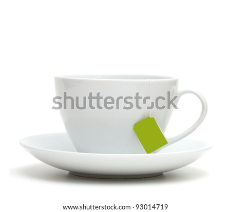 Cup of tea with tea bag (blank label) on white background