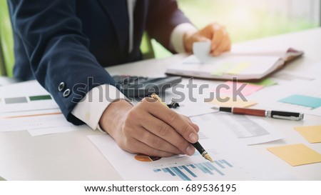 Close up accountant or banker making calculations. Savings, finances and economy concept.