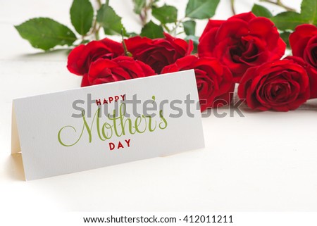 Close up of a beautiful bouquet of roses with a happy mothers day card