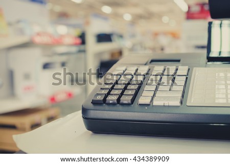 Close up one cash register with a bar code reader in department
