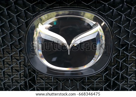 TURIN, ITALY - JUNE 10, 2017: Mazda logo on a car grill